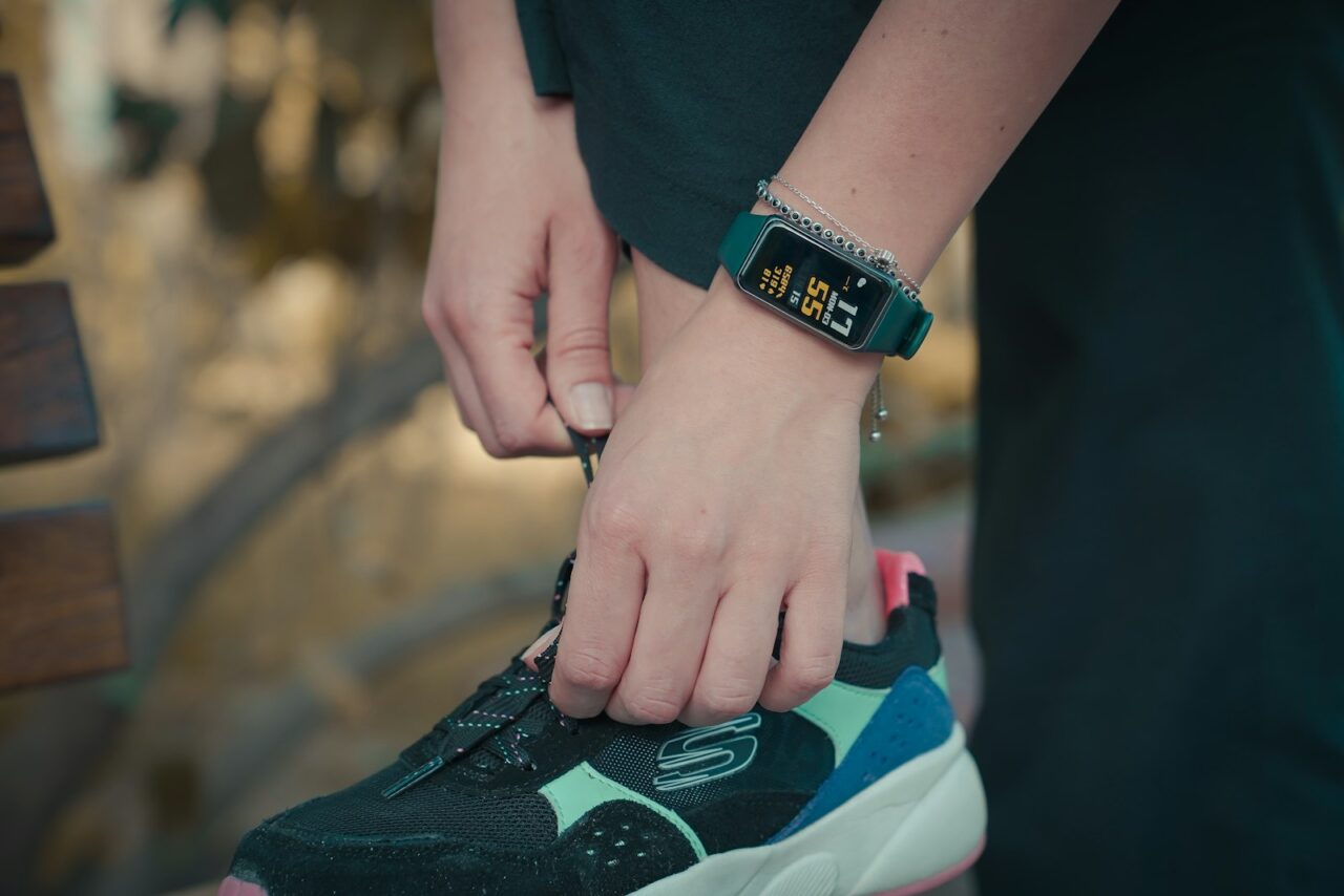 Close-up of a smartwatch on a wrist showing fitness tracking data during a workout