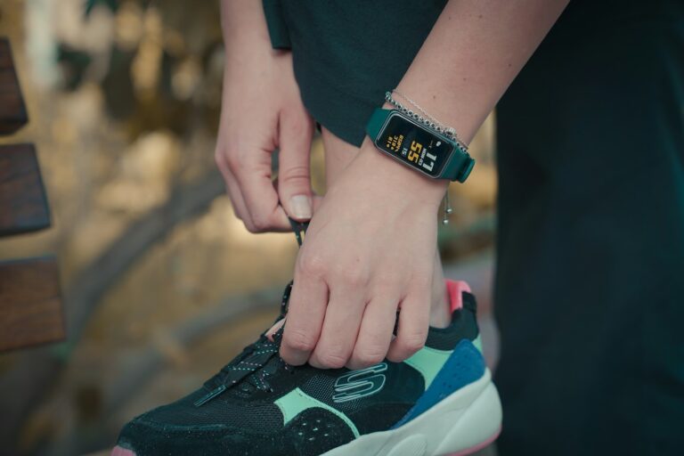 Close-up of a smartwatch on a wrist showing fitness tracking data during a workout
