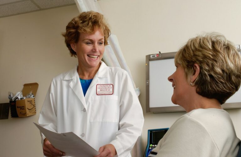 Woman talking with her doctor during a routine preventive health checkup