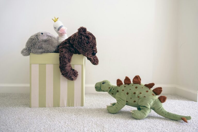 A shelf of soft plush toys arranged as a cozy collector display