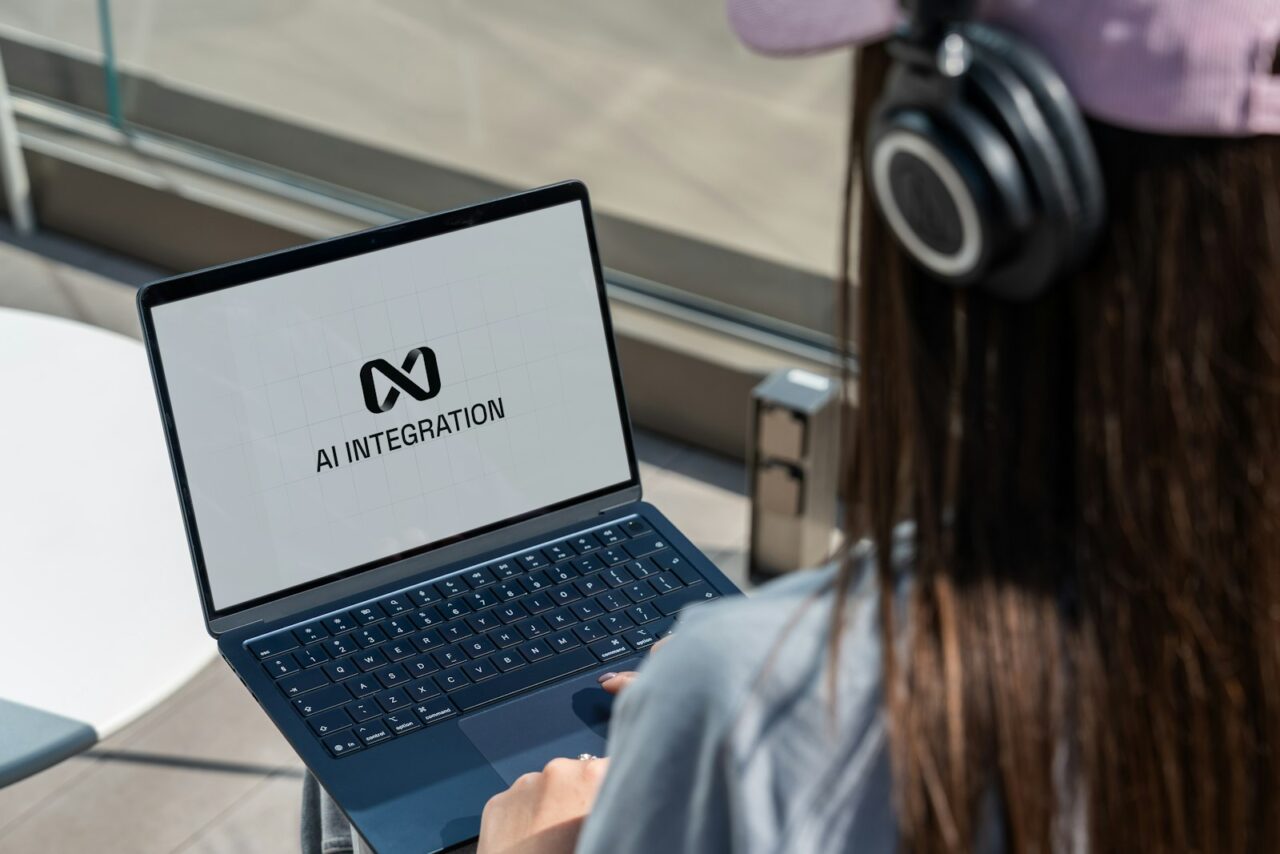 Office worker using an AI assistant on a computer in a modern workplace